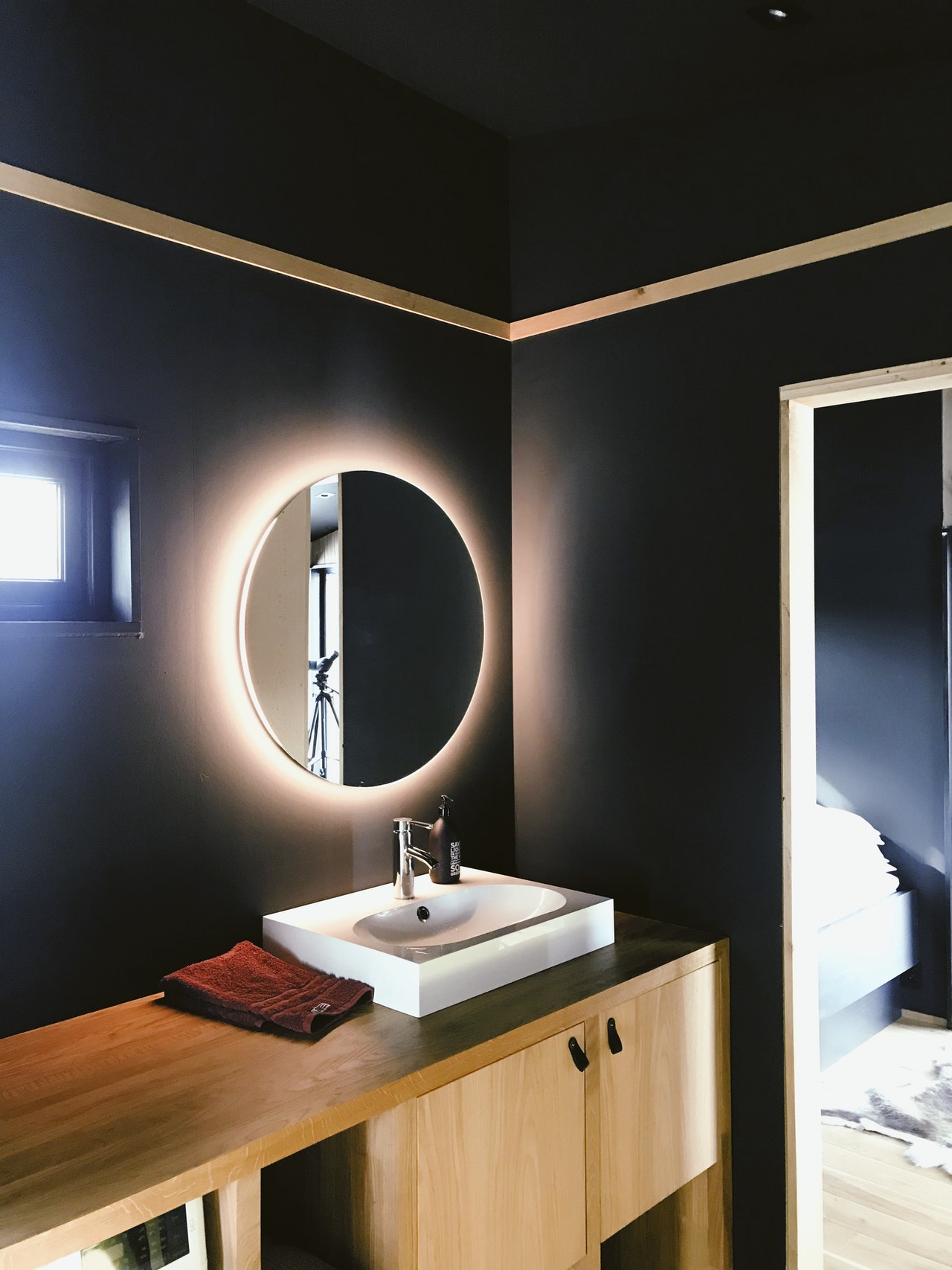 Navy Blue Bathroom with lighted mirror